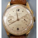 A 1940/1950's? Swiss 18k chronograph wrist watch, with two subsidiary dials, on a brown leather