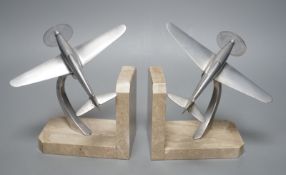 A pair of Art Deco chrome plated and marble aircraft book-ends, 17cm