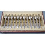 An early 20th century cased set of twelve French 950 standard white metal tea knives, spoons and