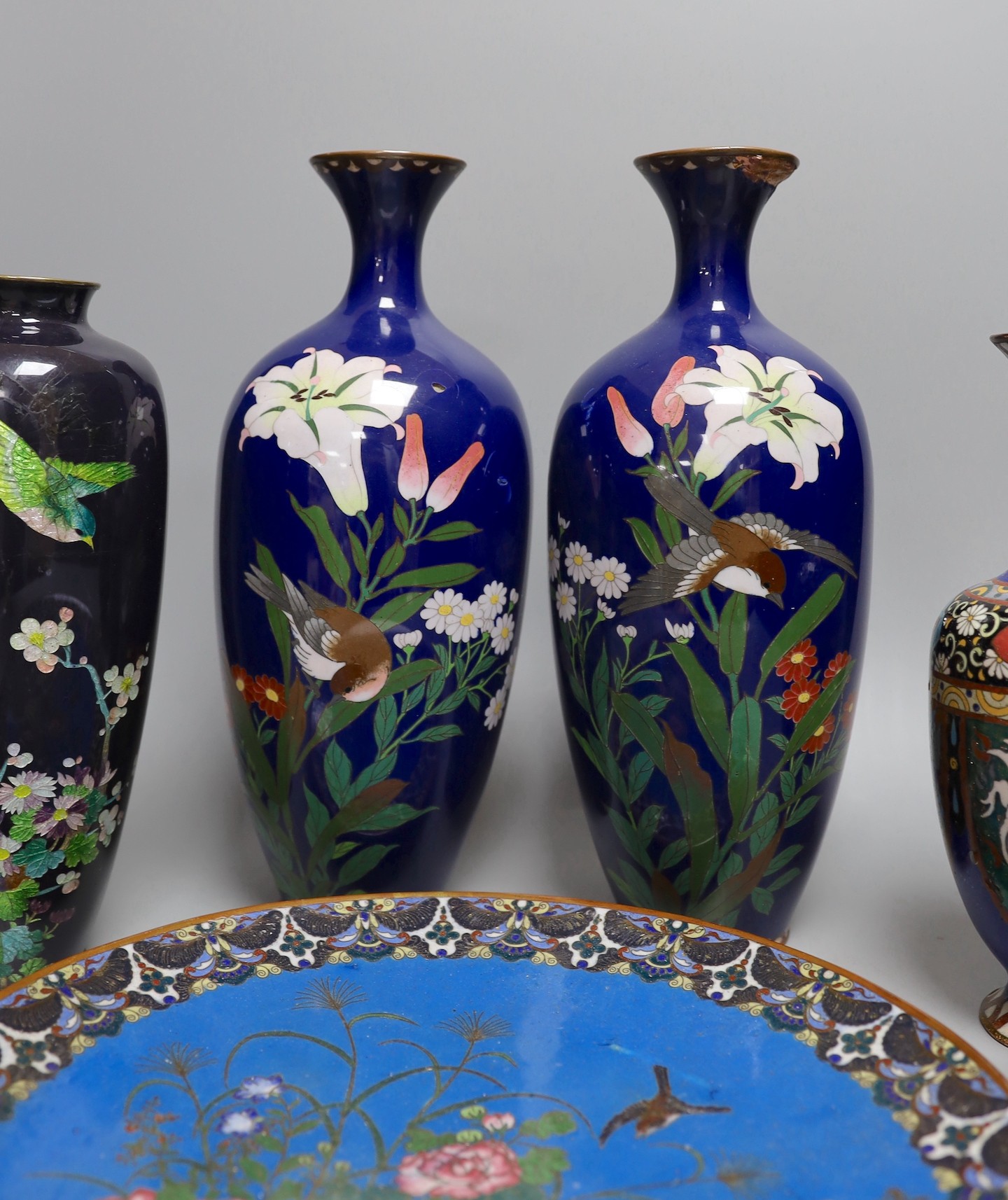 A group of Japanese cloisonné enamel wares to include a pair of vases, two other vases and a dish, - Image 4 of 7