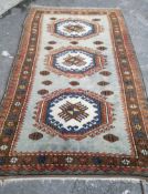 A Caucasian style pale blue ground geometric carpet, 260 x 150cm