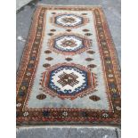 A Caucasian style pale blue ground geometric carpet, 260 x 150cm