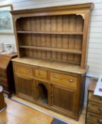 A Victorian pine dresser with boarded rack, length 182cm, depth 46cm, height 223cm