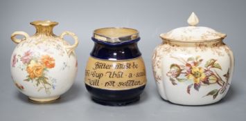 A late 19th / Early 20th century Doulton two handled vase and a Doulton vase and cover both