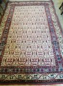A North West Persian ivory ground carpet, 300 x 198cm