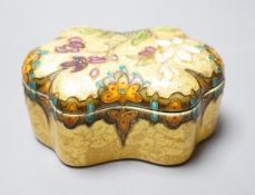 A Clement Massier, Golfe Juan box with enamelled floral decoration on ground yellow base, 9.5cm,
