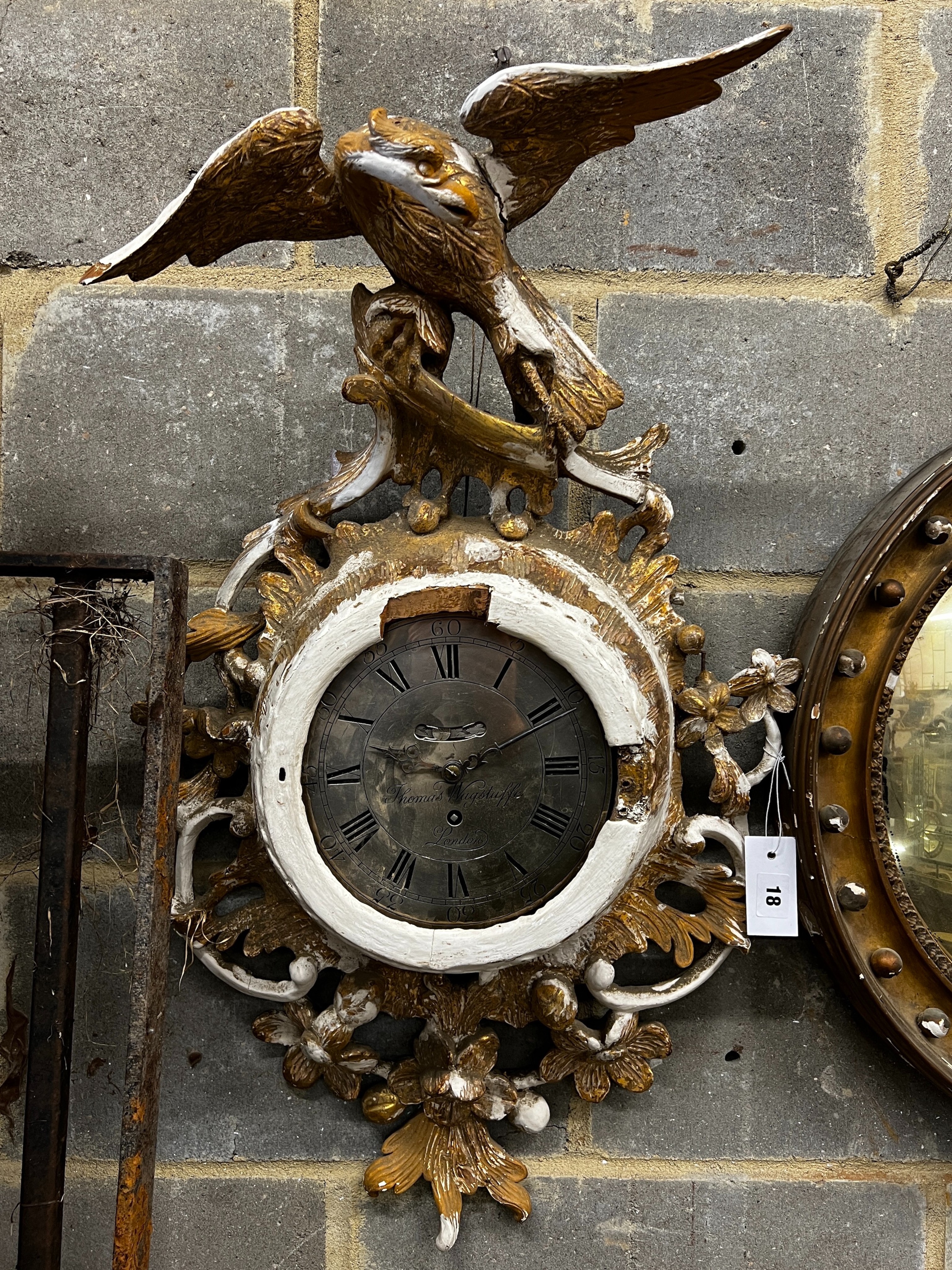 An early 19th century carved giltwood single fusee wall timepiece, silvered dial marked Thomas