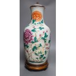 A large Chinese famille rose ‘peony and rockwork’ vase, converted into a lamp on wooden base, 53cm