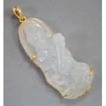 A modern 18k mounted carved jade figural pendant, overall 5cm, gross weight 10.8 grams.
