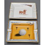 Two Hermes, Paris porcelain ashtrays: one golfing related (boxed), the other hunting related,golf