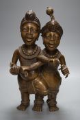 A Benin style bronze twin figure group, 33cm
