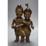 A Benin style bronze twin figure group, 33cm