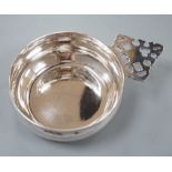 A modern Brittania standard silver bleeding bowl, by Tessiers Ltd, with pierced handle, diameter