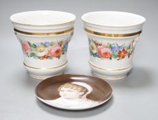 A 19th century pair of Paris porcelain flowers pot with Chinese figural heads, a chain of flowers