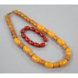 An amberoid expanding bracelet, and an amberoid necklace, 46cm.