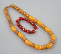 An amberoid expanding bracelet, and an amberoid necklace, 46cm.