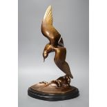 An Art Deco patinated bronze figure of a seabird, signed J B Leonard,47 cms high,