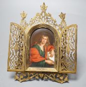 A Continental painted porcelain icon plaque in three fold pierced brass frame by Marion, London,