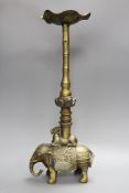 A Chinese bronze candle stand, 54 cms high,