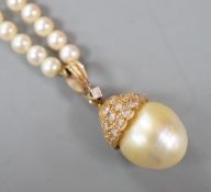 A modern cultured pearl and diamond cluster set drop 'acorn' pendant, overall 23mm on a cultured