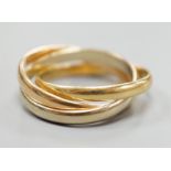 A modern Cartier three colour 750 yellow metal 'Russian' triple wedding ring, size U, 8.5 grams.