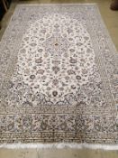 A Tabriz style cream ground carpet, 300 x 192cm