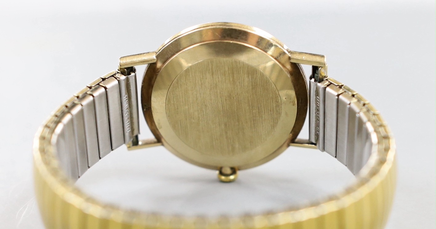 A gentleman's 1960' yellow metal Omega manual wind wrist watch, with date aperture, on associated - Image 4 of 4