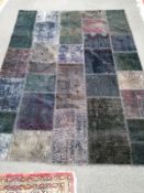 A multi coloured rug, 199 x 150cm