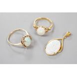 A 9k yellow metal and oval white opal set ring, size O, gross 2.1 grams, an 18ct yellow metal and