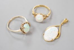 A 9k yellow metal and oval white opal set ring, size O, gross 2.1 grams, an 18ct yellow metal and