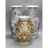 A pair of Chinese famille rose baluster vases and a bulbous brown glazed vase, all a.f, pair of