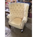 A Georgian style button back wing armchair, width 80cm, height 114cm