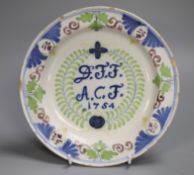 A Delft polychrome marriage plate, dated 1754, 22cm