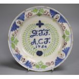 A Delft polychrome marriage plate, dated 1754, 22cm