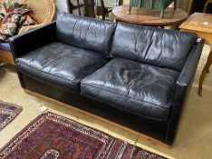 A black leather upholstered two seater settee, length 172cm