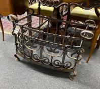 A cast and wrought iron fire grate, width 74cm, depth 35cm, height 51cm