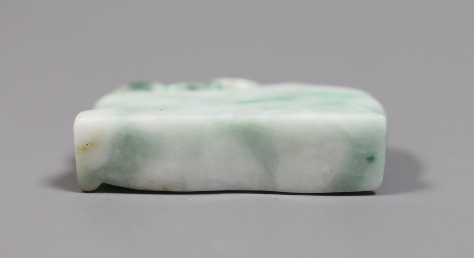 A Chinese jadeite Budai reclining figure, 6 cms wide, - Image 4 of 4