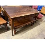 A mid century oak writing table with planked top and three drawers, length 130cm, depth 78cm, height