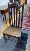 An early 18th century oak backstool dining chair
