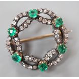 A late Victorian yellow and white metal, emerald and diamond cluster set open work brooch, 21m,