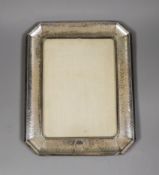 A George V planished silver mounted rectangular photograph frame, with canted corners, Synyer &