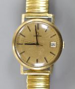A gentleman's 1960' yellow metal Omega manual wind wrist watch, with date aperture, on associated