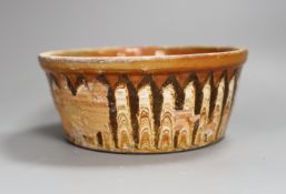 A Slipware conical bowl, 18th / 19th century, flaking to decoration, 19cm diameter