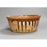 A Slipware conical bowl, 18th / 19th century, flaking to decoration, 19cm diameter