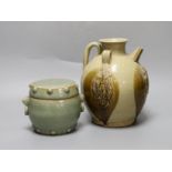 A Chinese buff-glazed wine pot and celadon jar and cover, 18.5cm