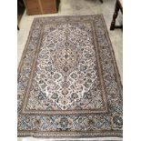A Nomadic Rug Persian style carpet with foliate motifs on a cream ground, 300 x 195cm