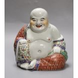 A Chinese enamelled porcelain seated Buddha, 19cm