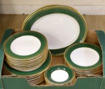 A Spode green and gold banded dinner set,