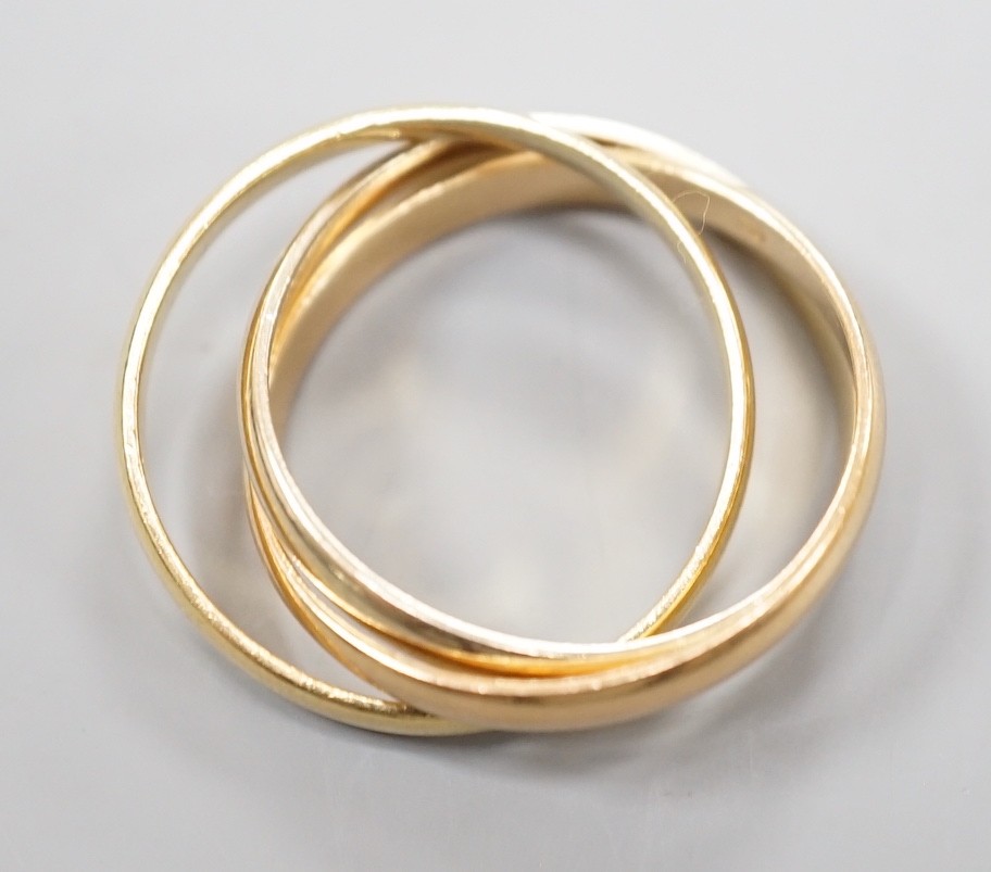 A modern Cartier three colour 750 yellow metal 'Russian' triple wedding ring, size U, 8.5 grams. - Image 3 of 5