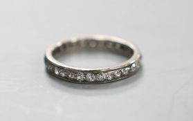 A white metal and diamond set full eternity ring, M/N, gross weight 2.7 grams.